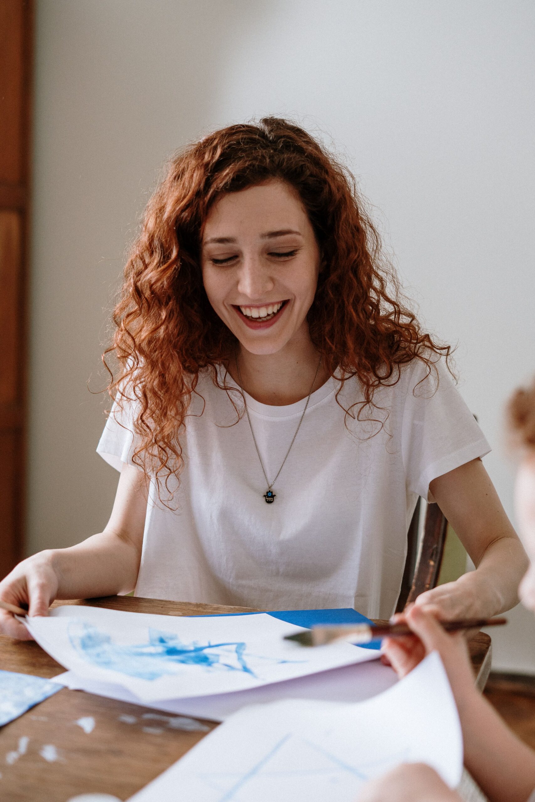 Adult using painting as part of an art therapy session