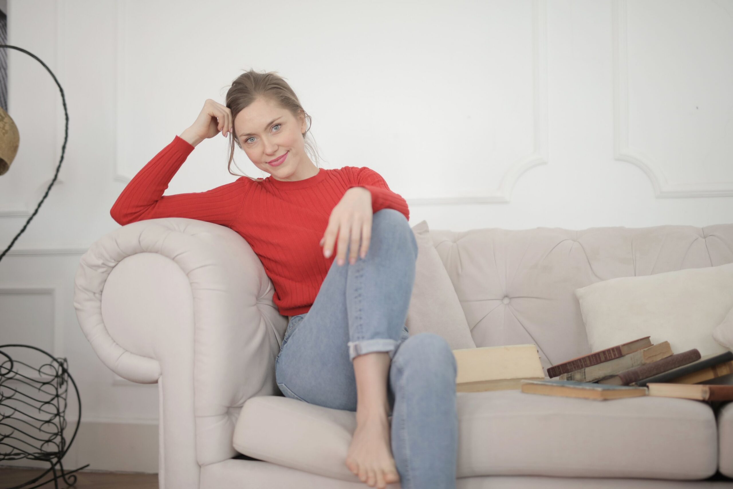 Woman sitting comfortably on a sofa representing OCD counseling in Bryn Mawr at Main Line Counseling Partners.